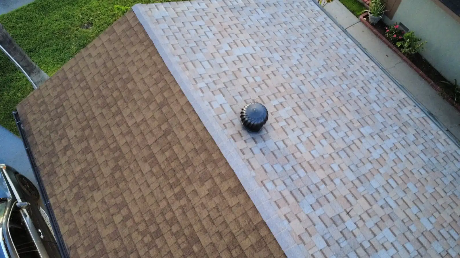 Two-tone asphalt shingle roof viewed from above